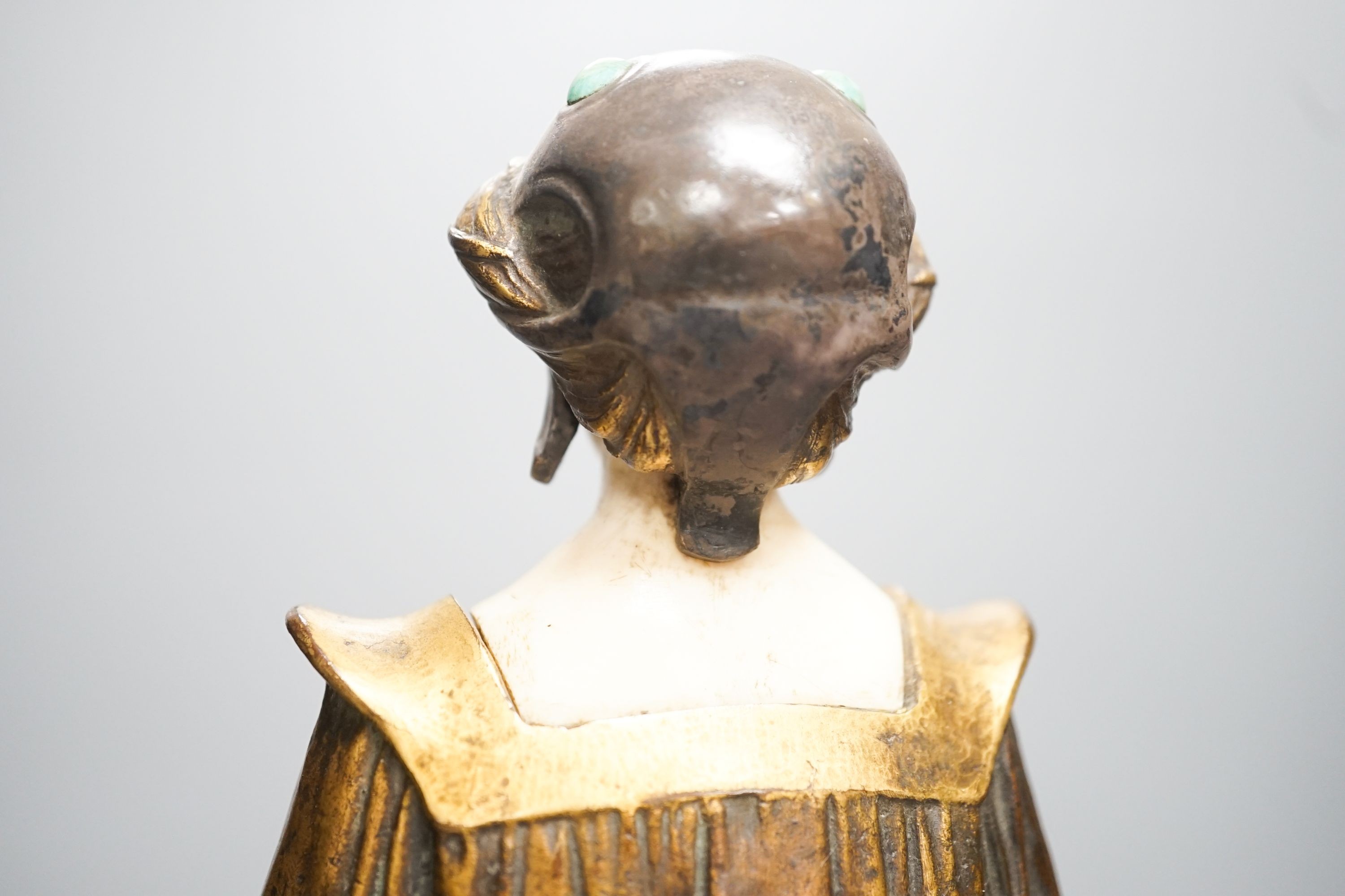 A German Art Nouveau bronze and ivory figure of Pandora, with inset carved ivory head and hands on polished stone and cut wood base, signed F. Jahn, 41cm high